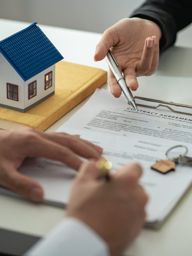 The real estate agent discusses the terms of the home purchase contract and asks the client to sign the documents to legally enter the contract. Ideas for selling a house at an office desk