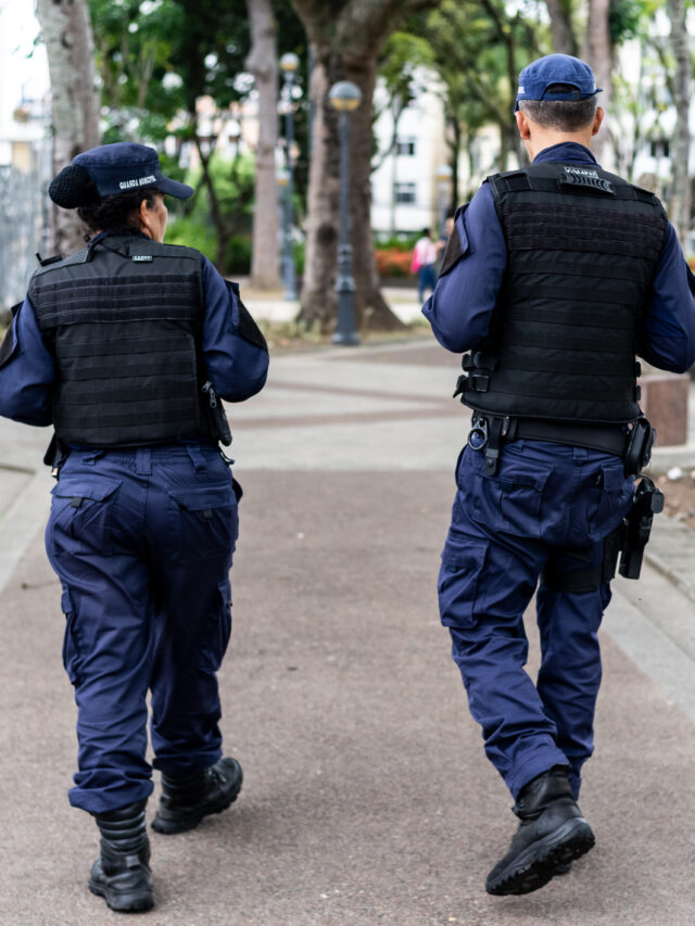 Two municipal guards patrolling the streets of Campo Grande square